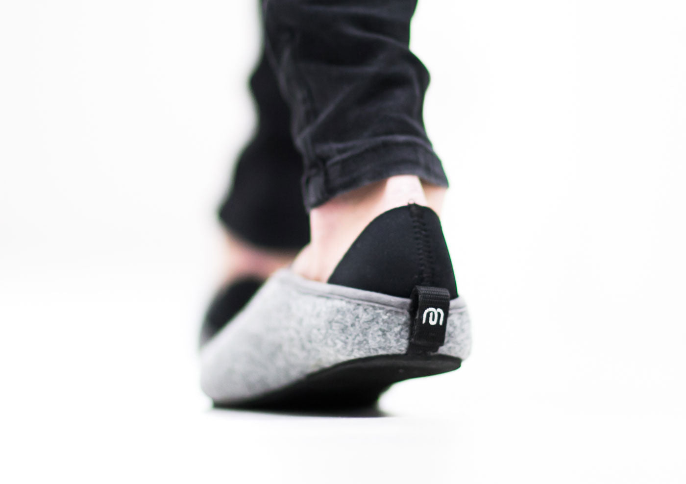 close up of the mahabis logo and fastener on the back of the mahabis slippers // about mahabis